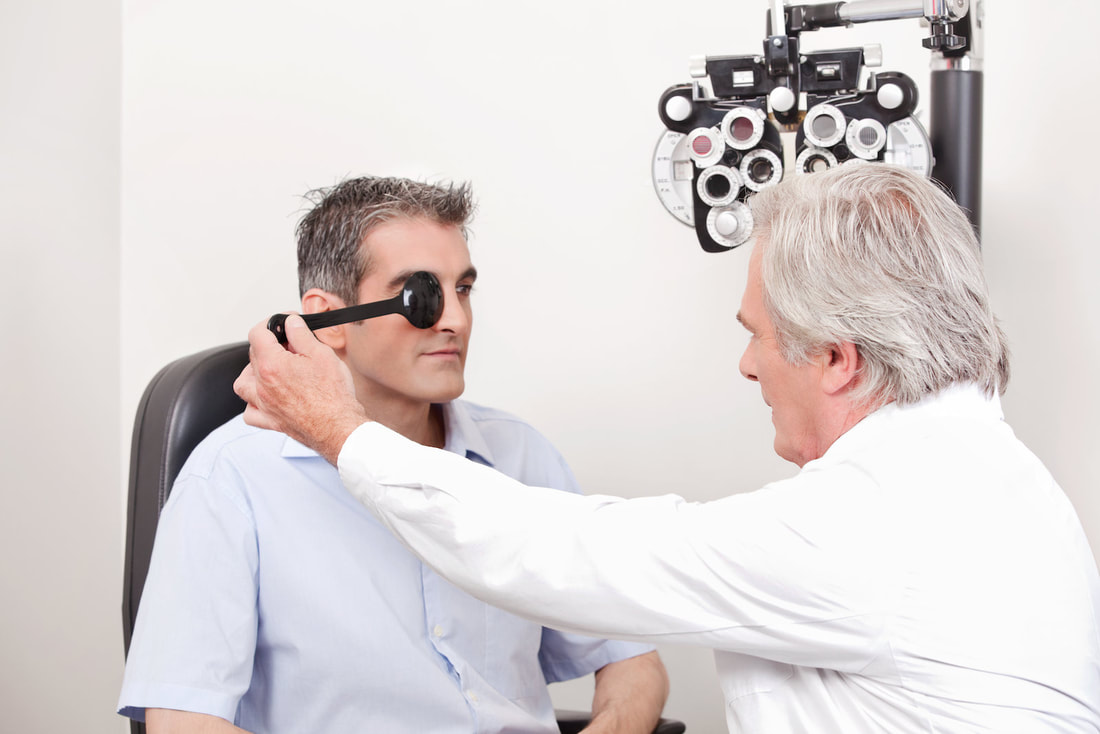 man getting his eyes checked 